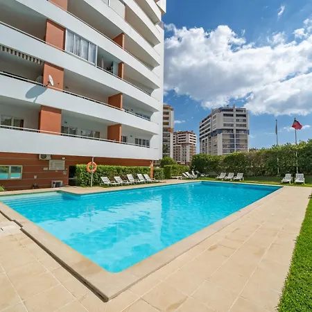 Sunlit Poolside Retreat W/ Balcony By Hostwise Portimao