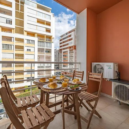 Apartment Sunlit Poolside Retreat W/ Balcony By Hostwise